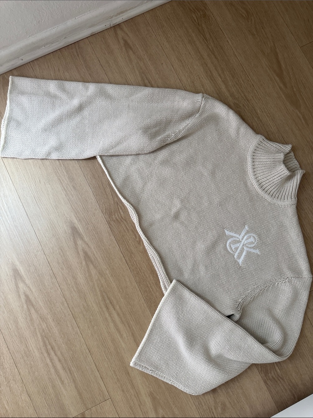 Kith Cropped Turtleneck Sweater with Embroidered Logo + Bell Sleeves - Beige